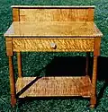 Washstand: bird's eye can be seen on the surface of drawer.