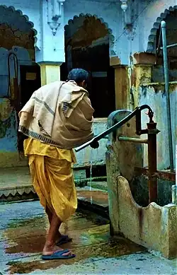 A man in dhoti and woollen shawl in Varanasi