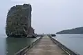 A dock and 30-metre-high (98&nbsp;ft) limestone cliff near the old prison site on the east side of the island