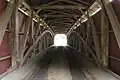 The inside of the bridge showing the Burr arch truss design