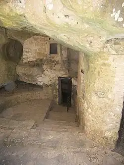 The exterior of the church of Aghia Kyriaki. The hermit's quarters are on the left of the church entrance]]