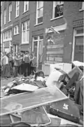 Residents throw belonging of Turks onto the street.