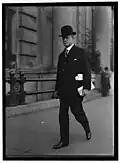 William C. Mooney, congressman from Woodsfield, Ohio, United States, in stroller and bowler hat (1915)