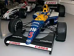 Williams Formula One car in yellow and blue livery with red 5 number