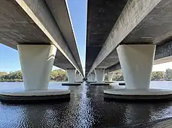 Two concrete bridges crossing a river next to each other