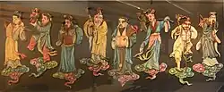 Eight separate painted reliefs of Chinese figures in white and blue robes carrying unique items and standing on blue and pink clouds.