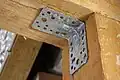 Angle bracket of galvanized steel used in a roof construction