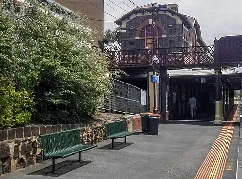 View from Platform 1 looking north-west, showing station building and footbridge