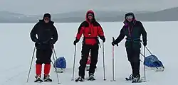Snowshoers with pulled pulks