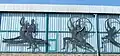Parts of the copper artwork Sport-Fries at the facade of the large sports halls complex .