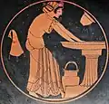 Kalē woman bathing at the laver, with a water bucket, a skyphos, and a wineskin, c. 500 BC
