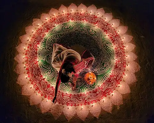 Image 43Woman lighting candles for Diwali, by AjoyDutta1997 (edited by Aristeas) (from Wikipedia:Featured pictures/Culture, entertainment, and lifestyle/Religion and mythology)
