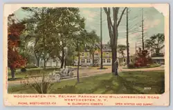 Color picture postcard showing a three-story building in a wooded setting. Printed under the photo is "Woodmansten Inn, Pelham Parkway and Williamsbridge Road, Westchester, N.Y."