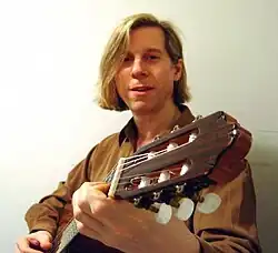 Woody Lissauer with classical guitar.
