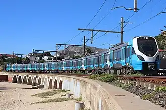 A Metrorail X'Trapolis Mega train running near Kalk Bay station.