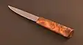 Yakutian knife with birch burr/burl handle. Left side.