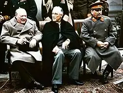 Winston Churchill (left) and Joseph Stalin (right) dressed in greatcoats at the Yalta Conference, 1945