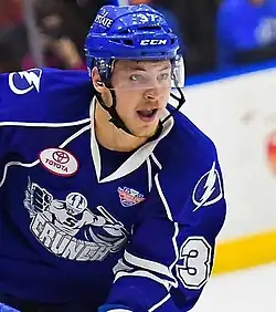 Ice hockey player in a Syracuse Crunch jersey with his mouth open