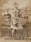 Young man with exotic fruit. Photo: Hoare.