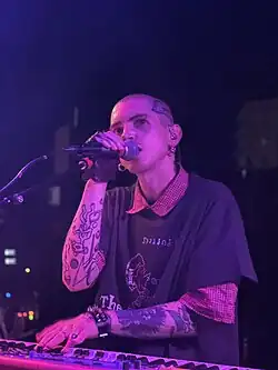 Powers performing in Denver in May 2025