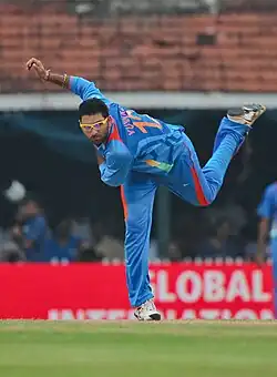 Colour photo of a cricketer bowling