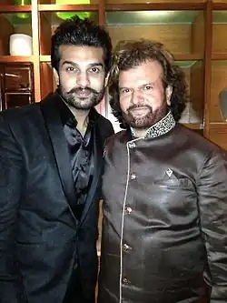 Yuvraj Hans(left) with father Hans Raj Hans(right)