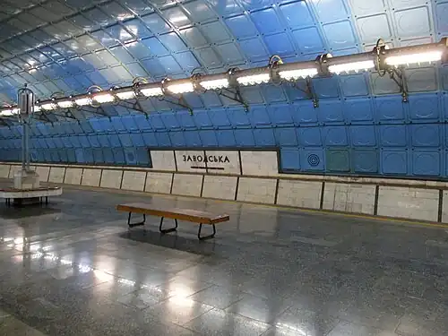 Underground station with a blue tiled ceiling