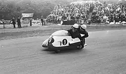 Two men in a sidecar