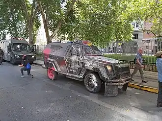 A Mahindra Marksman used by Carabineros' Fuerzas Especiales (now Control de Orden Público). Protesters have thrown paint at it.