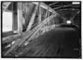 Interior view of double Burr Arches, Kings Posts, and upper truss.