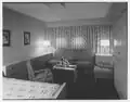 First-class cabin U 141, showing mid-century modern furnishings and the lack of detail common throughout the ship. Not shown is the cabin's private bath.[32]
