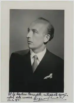 A black and white photograph of a serious man at bust lenght