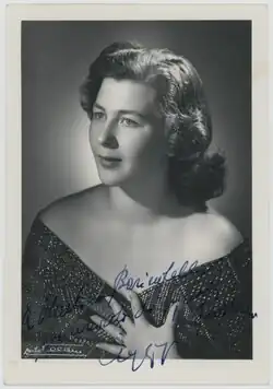 A black and white photograph of a woman