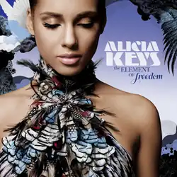 A woman with her eyes closed, wearing a feathered halter dress. Laid against a blue background, a white dove is seen flying behind her to the left. The name "Alicia Keys" is written to the right in white font and "The Element of Freedom" is written below that in dark blue font.