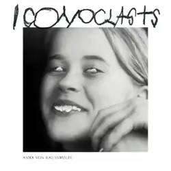 A black-and-white photo of the artist with seashells covering her eyes and teeth against a white background, with the hand-drawn title "Iconoclasts" in all caps above the image, and her name to the bottom-left of the image.
