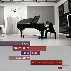 A photo of Tench at a grand piano