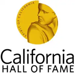 Gold medallion with a person looking over their shoulder