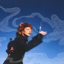 A blurry photograph of a man running outside while holding a pair of scissors; behind him is a clear, blue sky with abstract geometric waves.