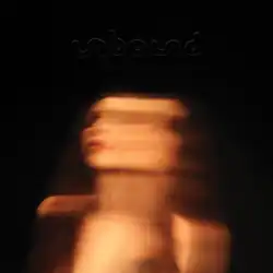 A bright, faded photo of Wolfe with the EP's name above her.