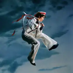Donning a sailor outfit, Conan jumps mid-air against blue stormy clouds. He holds a giant metallic wishbone.
