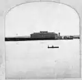 Council Bluffs Transfer Depot in the Missouri River flood of 1881, water fills the Union Pacific Railroad railyard up to the Union Pacific Railroad Transfer Depot and hotel