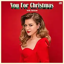 Clarkson dressed in red beneath the song's title