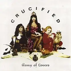 Three people sitting, with "CRUCIFIED" arched above them, and the bands name straight under them.