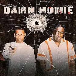 Image of two men with one of them holding a gun.