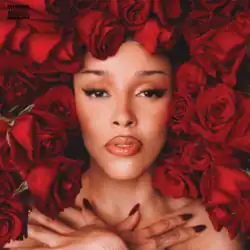 A portrait of a Doja Cat surrounded by bouquets of red roses.