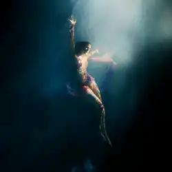Cover artwork of Higher Than Heaven, showing Goulding underwater in a dark blue setting, illuminated by a beam of light as she extends her arms upward