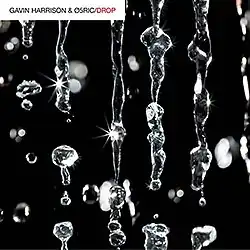 New artwork featuring sparkling water droplets against a black background.