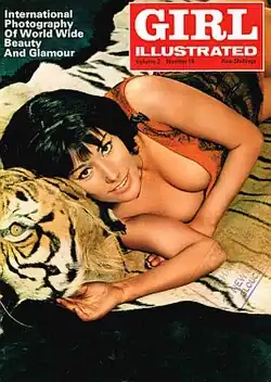 A scantily dressed young woman lying on a tiger skin.