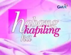 An image with a pink and white background. The series title is displayed on the center of the image. The logo of GMA Network is displayed on the upper right side of the image.