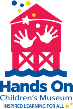 Red water tower with two handprints